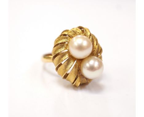 EIGHTEEN CARAT YELLOW GOLD AND PEARL SET DRESS RINGwith the pearls on a pierced and moulded setting, size K   