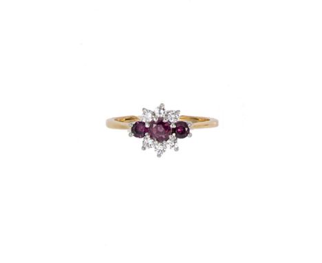 A ruby and diamond cluster ring, three round faceted rubies, diameter from approximately 3 to 4.3mm, surrounded by six round 