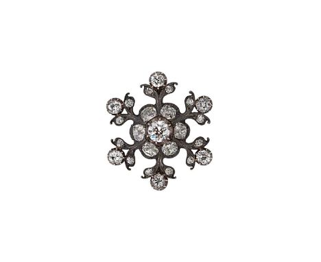 A Victorian diamond set snowflake style brooch,  central old European cut diamond, estimated approximate weight 0.65ct, surro