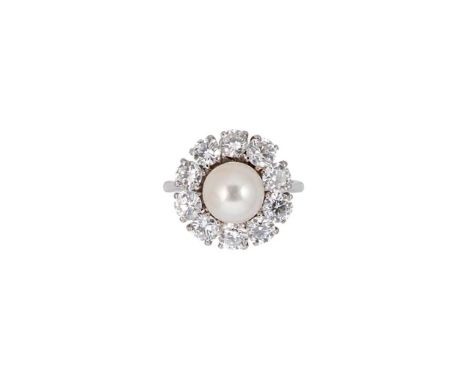 A cultured pearl and diamond cluster ring, central 8.5mm cultured pearl, surrounded by ten round brilliant cut diamonds, esti