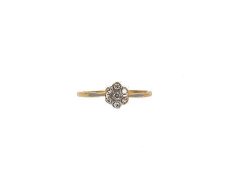 A diamond set daisy style cluster ring, seven eight cut diamonds, head diameter 8.5mm, size W, unhallmarked, stamped '18CT', 