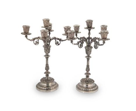 A pair of mid 20th century Italian metalwares five light candelabra, mark of Fassi Arno, Milan, marked 800 for 800/1000 stand