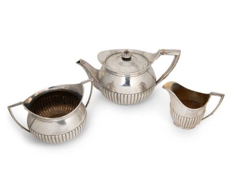 A Victorian silver three-piece tea set, mark of Walter &amp; John Barnard, London 1878, the teapot of somewhat bulbous form, 