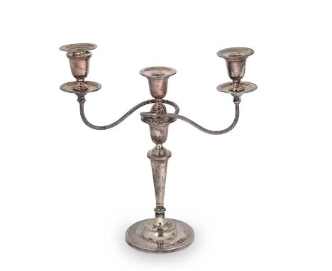 An Elizabeth II silver metamorphic three light candelabra, probable mark of E. H. Parkin &amp; Company, Sheffield 1965, circu