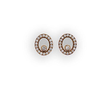 Chopard - A pair of 'Happy diamond' ear studs, oval shaped, each set with a single floating round brilliant cut diamond, surr