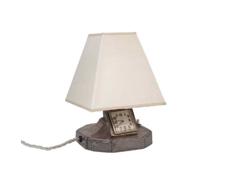 A George VI silver bedside lamp with clock, mark of Walker &amp; Hall, Sheffield 1937, filled octagonal base with push switch