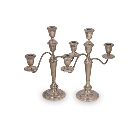 A pair of 20th century American metalwares silver metamorphic three light candelabra, mark of the Alvin Corporation, Providen