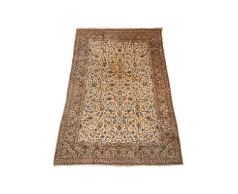 A KASHAN CARPETApproximately 410 x 273cmCondition Report: Overall with wear and signs of use in a domestic settingThere is ho