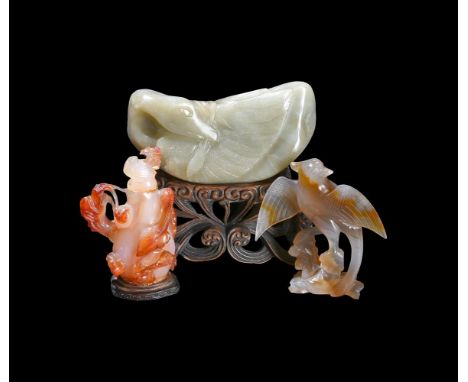 A GROUP OF THREE CELADON JADE AND AGATE CARVINGS 20TH CENTURYIncluding: A large Chinese celadon jade 'Duck' with wood stand, 