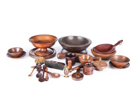 A COLLECTION OF VARIOUS TREEN 19TH AND 20TH CENTURIES Comprising nine turned bowls and beakers, two plates, two footed bowls,