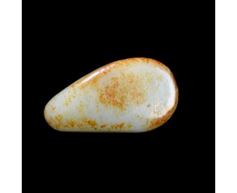 A SMALL CHINESE INSCRIBED CELADON JADE PEBBLE20TH CENTURYInscribed to one side with the poem, 8.5cm x 4.8cmCondition Report: 