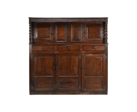 AN OAK COURT CUPBOARD BEARING DATE 1728 TO THE FRIEZE185cm high, 191cm wide, 56cm deepCondition Report: The recess shelf with