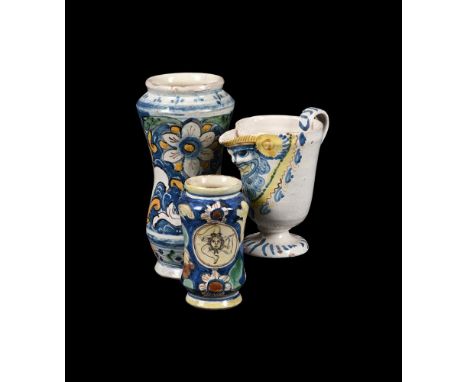 THREE ITEMS OF SICILIAN MAIOLICA19TH CENTURYComprising: two various albarelli typically decorated, 15 and 25cm high, and a ew