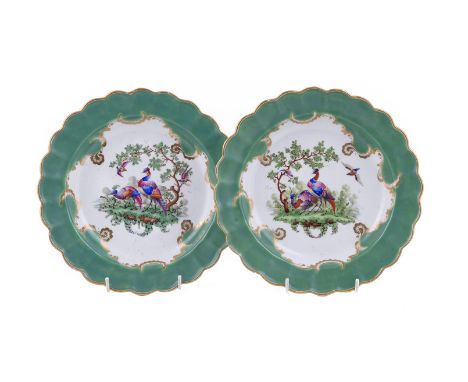 A PAIR OF WORCESTER APPLE-GREEN GROUND PLATES PAINTED WITH EXOTIC OR 'FANCY BIRDS' CIRCA 1775 Paper collection labels, un-mar
