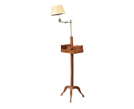 A MAHOGANY FLOOR STANDING LAMP20TH CENTURYWith book trough section122cm high overall including fitment and shade 