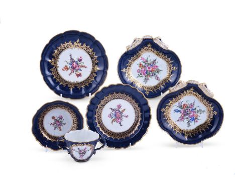 A SELECTION OF WORCESTER GROS BLEU GROUND PORCELAINCIRCA 1775Painted with central bouquets of flowers within 'wet' blue and g