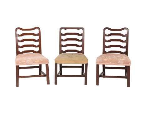 A GROUP OF THREE GEORGE III MAHOGANY LADDERBACK DINING CHAIRSLATE 18TH CENTURYComprising a pair with rounder corners to the c