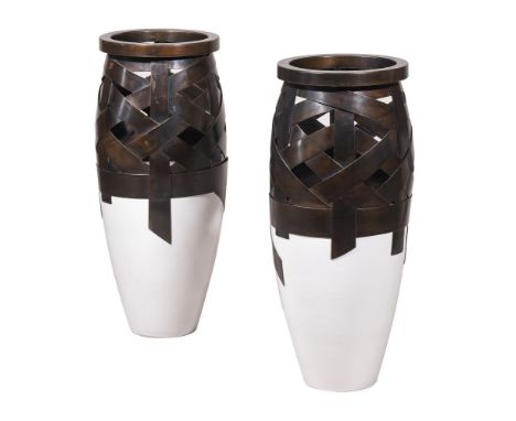 A PAIR OF WHITE GLAZED CERAMIC AND PATINATED METAL FLOOR VASESMODERNThe basketwork top section above a tapering base81cm high
