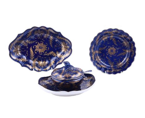 A WORCESTER BLUE-GROUND AND GILT SAUCE TUREEN, COVER, LADLE AND STANDCIRCA 1770Decorated with stylised flowers and foliage, t