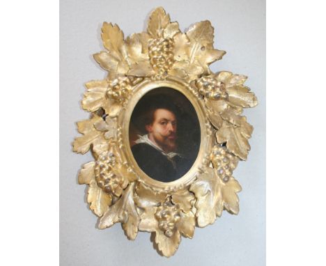 AFTER SIR PETER PAUL RUBENS (1577-1640) PORTRAIT OF THE ARTIST Oil on board, oval, within a carved and gilded frame with vine
