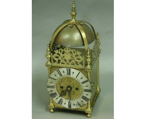 A LANTERN CLOCK of 17th century design, striking fusee movement with anchor escapement, the brass case with silvered chapter 