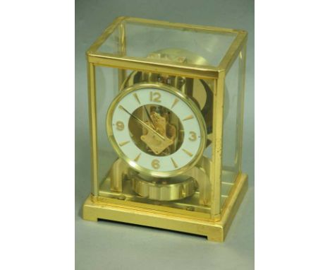 A JAEGER LE COULTRE ATMOS MANTEL CLOCK No. 162134 with white chapter ring in brass and glazed case. 8.75" (22cm) high With tr