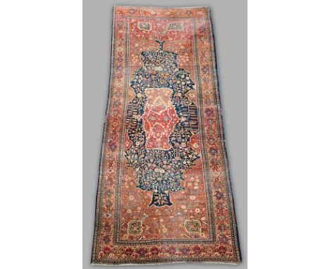 A MALAYER CARPET (cut and joined along the length, overall wear, some old moth damage and holes, also slight losses to both e