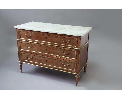 A LOUIS XVI MAHOGANY COMMODE with a marble top fitted with three long drawers all with brass fillets 47" (119 cms) wide, 34.5