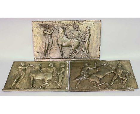 THREE CAST IRON PLAQUES with brassed finish, embossed with classical reliefs.  One panel bearing inscription 'Henning, 1819, 