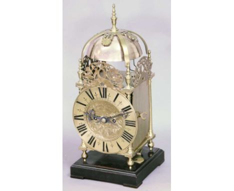 A BRASS LANTERN CLOCK in 17th century style, the movement with anchor escapement and chain fusee and striking on two bells, i