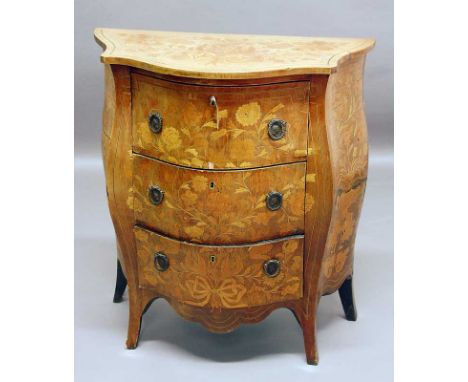 A DUTCH MAHOGANY COMMODE decorated with floral marquetry, the bombe serpentine front with three drawers 30.25" (77cm) wide