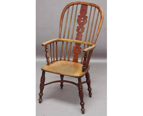 A WINDSOR ARMCHAIR OF ELM AND ASH with stick back, pierced splat and curved stretcher