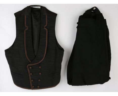 Mens Costume Waistcoat and Trousers.-  a black double-breasted waistcoat, trimmed with brown piping to collar with matching b