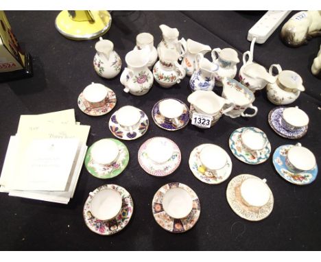 Collection of Royal Worcester miniature jugs, cups and saucers in various patterns some with certificates