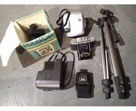 Mixed cameras including Polaroid and a Vanguard tripod 
