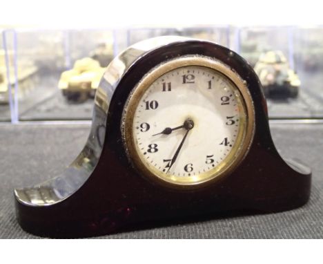 Miniature 1920s bakelite clock  CONDITION REPORT: L: 12.5cmH: 7cm 216g Very minor damage to the item, this is also not workin