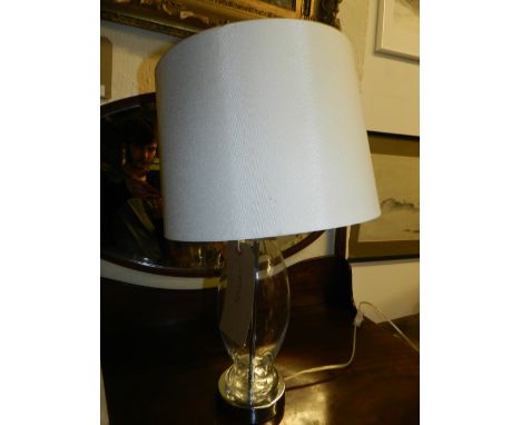 A contemporary chrome plated and moulded glass table lamp. 