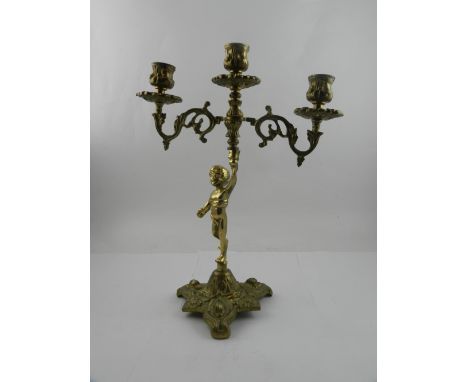 A three light two branch candelabra, having cast metal base with decorations of fish