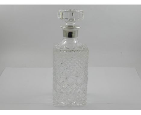 A cut glass decanter, having silver collar hallmarked for London H.25.5cm