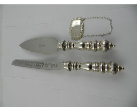 A silver decanter label, hallmarked for London, having Hebrew Jewish inscription, together with a white metal handled carving