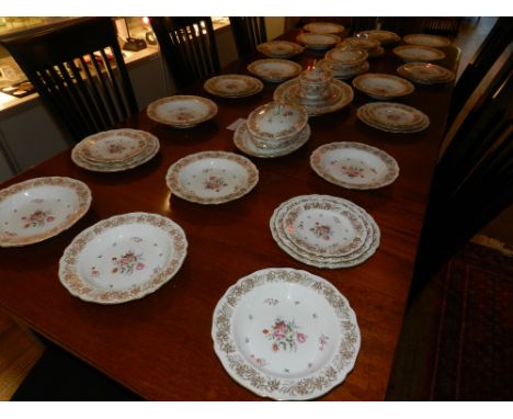 A comprehensive Copeland Spode dinner service,  painted floral designs on a gilt heightened cream ground . 