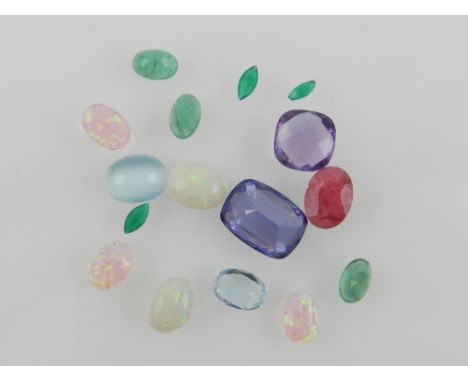 A small collection of gem stones and others, to include small opals and a faceted amethyst, etc.