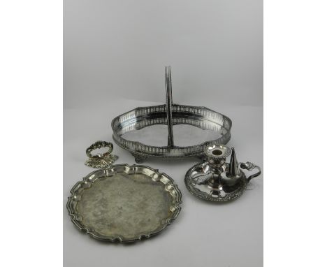A silver plated salva, having high crest edge, together with a hand held candlestick and stopper, together with oval shaped s