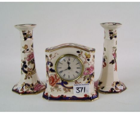 A pair of Masons Blue Mandalay candlesticks: together with a mantle clock. Height of tallest 17cm (3) 