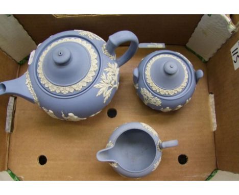 Wedgwood blue jasperware tea service: to include teapot, milk jug and sugar bowl (3). 
