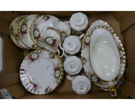 A collection of Royal Albert Celebrations Patterned items to include: Coffee Cups, Saucers, Side Plates, Platter, Gravy Boat 