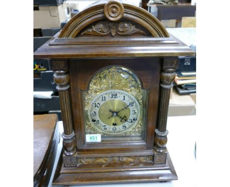 A large wooden mantle clock: Height 47cm 