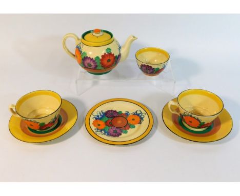A Clarice Cliff Gayday pattern tea set for two, lacking creamer, one cup has hairline