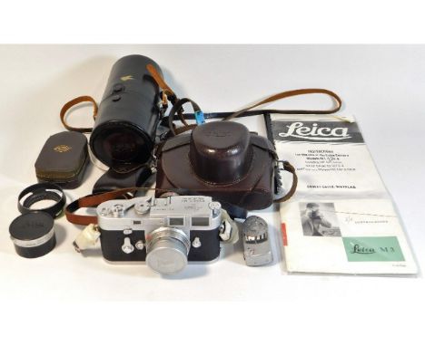 A Leica M3 camera &amp; lens twinned with a Leica light meter, a Leitz lens case, Leitz lens cover &amp; hood, a Weston light