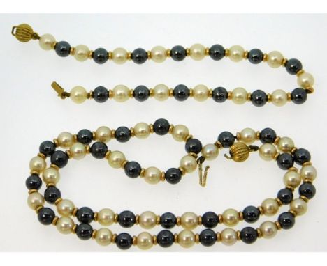 A two colour cultured pearl necklace &amp; bracelet set with 9ct gold fittings, necklace clasp, 13.5in &amp; 6.5in long respe